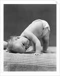1940s Baby Bending Down With Head On Blanket by Anonymous
