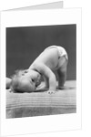 1940s Baby Bending Down With Head On Blanket by Anonymous