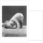 1940s Baby Bending Down With Head On Blanket by Anonymous