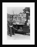 1940s Boy Sitting At Corner Newsstand Writing In Notepad by Anonymous