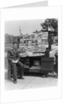 1940s Boy Sitting At Corner Newsstand Writing In Notepad by Anonymous