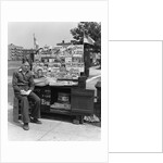 1940s Boy Sitting At Corner Newsstand Writing In Notepad by Anonymous