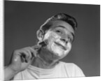 1950s Young Man Shaving With Safety Razor by Anonymous