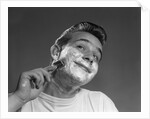 1950s Young Man Shaving With Safety Razor by Anonymous