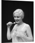 1930s Woman Holding Tooth Paste And Tooth Brush Btushing Teeeth by Anonymous