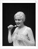 1930s Woman Holding Tooth Paste And Tooth Brush Btushing Teeeth by Anonymous