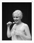 1930s Woman Holding Tooth Paste And Tooth Brush Btushing Teeeth by Anonymous