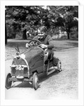 1930s Boy Driving Home Built Race Car Holding Steering Wheel by Anonymous
