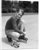 1930s Boy Fastening Metal Roller Skates by Anonymous