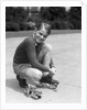 1930s Boy Fastening Metal Roller Skates by Anonymous