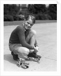 1930s Boy Fastening Metal Roller Skates by Anonymous