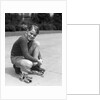 1930s Boy Fastening Metal Roller Skates by Anonymous