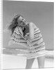 1950s 1960s Woman Wrapped In Stripped Towel Drying Hair On Beach Smiling by Anonymous