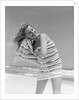 1950s 1960s Woman Wrapped In Stripped Towel Drying Hair On Beach Smiling by Anonymous