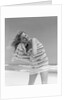 1950s 1960s Woman Wrapped In Stripped Towel Drying Hair On Beach Smiling by Anonymous