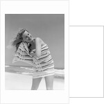1950s 1960s Woman Wrapped In Stripped Towel Drying Hair On Beach Smiling by Anonymous