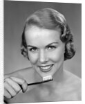 1950s Woman Holding Tooth Brush by Anonymous