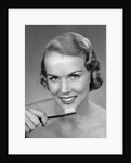 1950s Woman Holding Tooth Brush by Anonymous