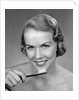 1950s Woman Holding Tooth Brush by Anonymous