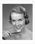 1950s Woman Holding Tooth Brush by Anonymous