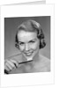 1950s Woman Holding Tooth Brush by Anonymous