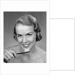 1950s Woman Holding Tooth Brush by Anonymous