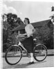 1950s Teen Girl Standing With Bike by Anonymous