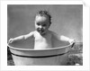 1930s Wet Baby In Washtub Sticking Out Tongue by Anonymous