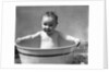 1930s Wet Baby In Washtub Sticking Out Tongue by Anonymous