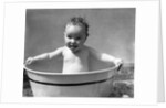 1930s Wet Baby In Washtub Sticking Out Tongue by Anonymous