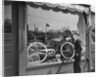 1950s Boy On Sidewalk Looking At Bicycle In Store Window by Anonymous