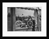 1950s Boy On Sidewalk Looking At Bicycle In Store Window by Anonymous