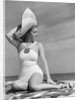 1940s Woman In White Bathing Suit On Beach Wearing Big Straw Hat by Anonymous