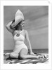 1940s Woman In White Bathing Suit On Beach Wearing Big Straw Hat by Anonymous