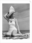 1940s Woman In White Bathing Suit On Beach Wearing Big Straw Hat by Anonymous
