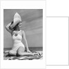 1940s Woman In White Bathing Suit On Beach Wearing Big Straw Hat by Anonymous