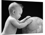 1940s Baby With Hands On Globe Looking At The Earth by Anonymous