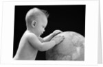1940s Baby With Hands On Globe Looking At The Earth by Anonymous