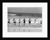 1930s Group 7 People Holding Hands Running Out Of Surf Onto Beach by Anonymous