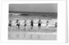 1930s Group 7 People Holding Hands Running Out Of Surf Onto Beach by Anonymous
