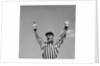 1950s Football Referee Making Touchdown Signal by Anonymous