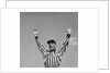 1950s Football Referee Making Touchdown Signal by Anonymous