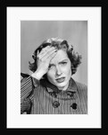 1950s Stressed Woman In Striped Dress Hold Forehead With Hand by Anonymous