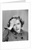 1950s Stressed Woman In Striped Dress Hold Forehead With Hand by Anonymous