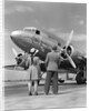 1940s Rear View Of Boy and Girl Standing Together Looking At Propeller Airplane Outdoor by Anonymous