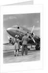 1940s Rear View Of Boy and Girl Standing Together Looking At Propeller Airplane Outdoor by Anonymous