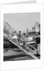 1950s Family Boarding Propeller Airliner By Climbing Gangway Stairs At Airport by Anonymous