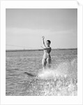 1960s Woman Water Skiing Waving With One Hand by Anonymous