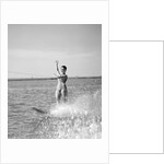 1960s Woman Water Skiing Waving With One Hand by Anonymous