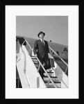 1960s Businessman Deplaning From Airplane Wearing Hat And Carrying Overcoat And Briefcase by Anonymous